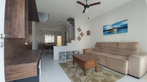 imagem 1 - Charmoso sobrado Massaguaçu para locação ou venda com 2 suítes, mobiliado à 80 metros da orla. Excelente localização. imagem 1 - Charmoso sobrado Massaguaçu para locação ou venda com 2 suítes, mobiliado à 80 metros da orla. Excelente localização.